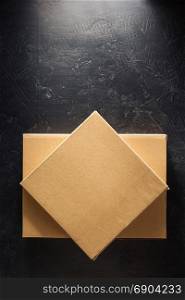 cardboard box on black background surface