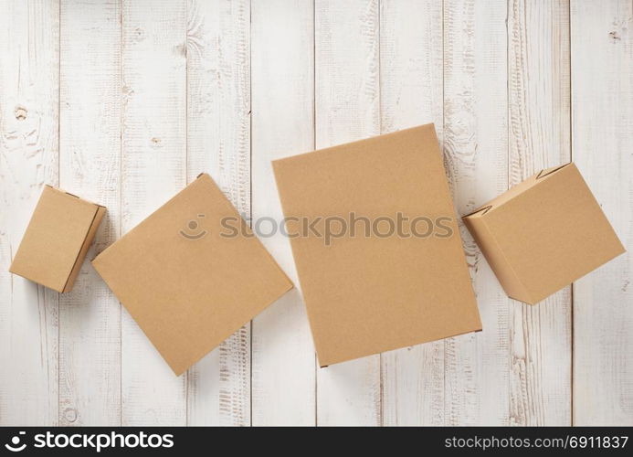 cardboard box on white wooden background