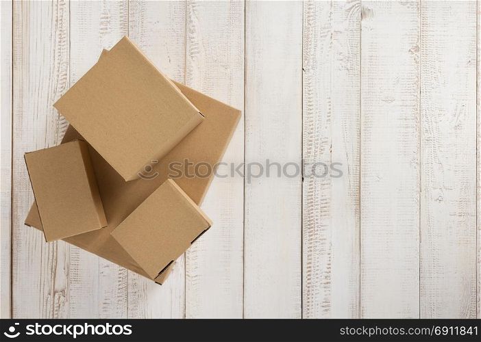 cardboard box on white wooden background