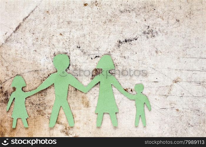 Cardboard figures of the family on a old dirty background