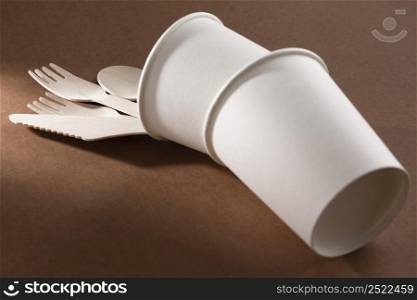 cardboard knife fork overturned cups
