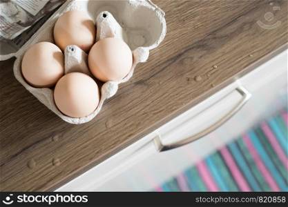 Cardboard of fresh free-range eggs in the kitchen