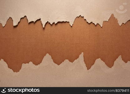 Cardboard torn paper as background texture. Brown paper