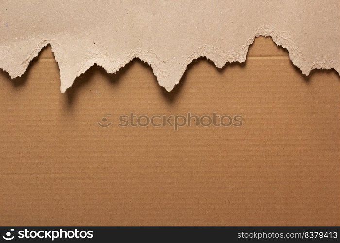 Cardboard torn paper as background texture. Brown paper