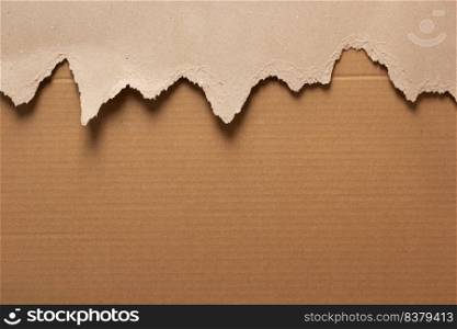 Cardboard torn paper as background texture. Brown paper