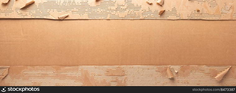 Cardboard torn paper as background texture. Brown paper