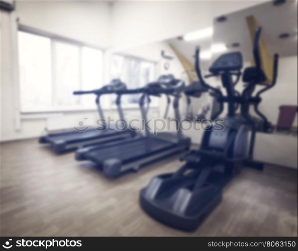 Cardio in gym against the window shot with blurred focus. Cardio in gym against the window