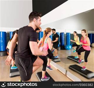 Cardio step dance people group at fitness gym training workout