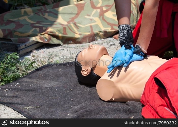 Cardiopulmonary resuscitation (CPR) being performed on a medical-training manikin