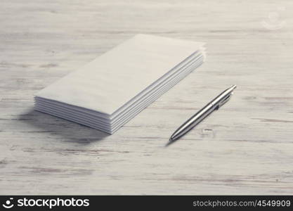 Cards for business notes. Blank white cards on wooden vintage table