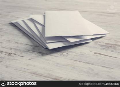Cards for business notes. Blank white cards on wooden vintage table