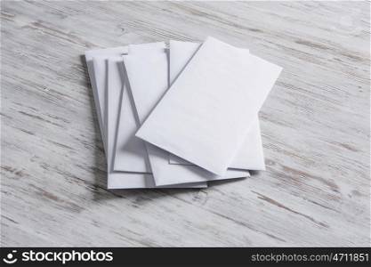 Cards for business notes. Blank white cards on wooden vintage table
