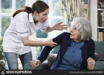 Care Worker Mistreating Senior Woman At Home