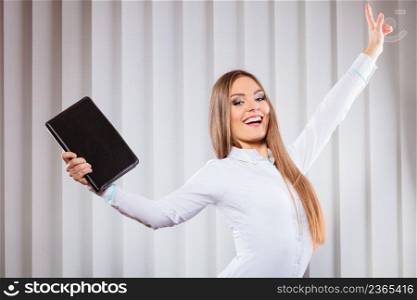 Career business success in work. Young woman in formal wear hold case with files documents paperwork hold hand in air show victory gesture.. Female office worker hold case show victory sign.