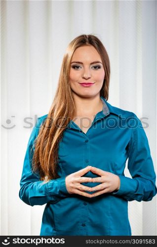 Career business work in office formal wear. Young woman worker present stand with confidence hand gesture.. Young woman office worker stand indoors.