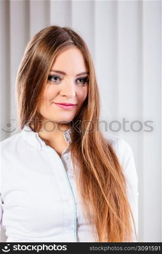 Career business work in office formal wear. Young woman worker present stand with confidence smiling.. Young woman office worker stand indoors.