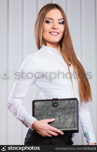 Career business work in office. Young woman in formal wear hold case with files documents paperwork.. Young woman office worker hold case with files.