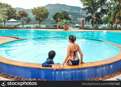 Carefree Couple relaxation in swimming pool summer Holiday concept