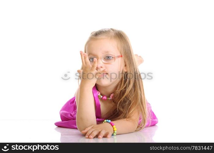 Carefree days of childhood. Cute little girl lying on floor counting with fingers studio shot isolated on white background