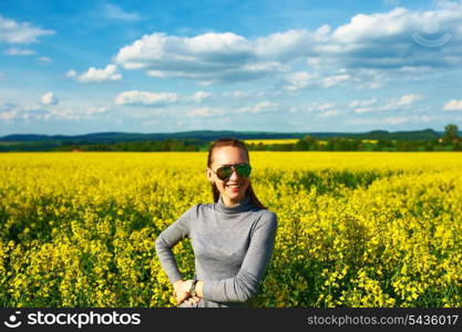 Carefree girl at colza field