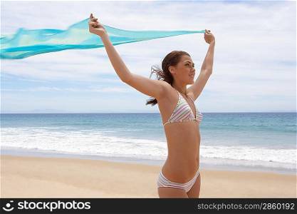Carefree Young Woman on Beach