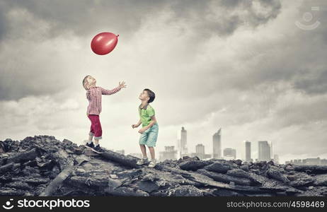 Careless happy children. Little cute boys playing joyfully with colorful balloon