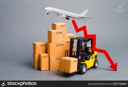 Cargo airplane, forklift truck with cardboard boxes and a red arrow down. Drop in industrial production and business. Decrease freight transportation and volumes of delivery of products and goods.