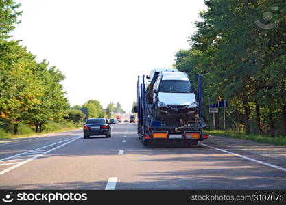 cargo cars on asphalt road