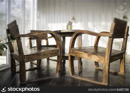 Cargo container cafe with wooden furniture set, stock photo