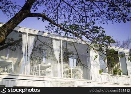 Cargo container house against blue sky background, stock photo