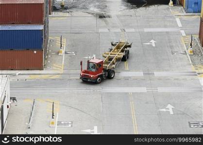 Cargo Containers Truck In Storage Area Of Freight Port Terminal