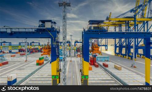 Cargo operation by crane are stopped effect by covid-19 pandemic around the world economic down crisis, Crane and container shipping export import business logistic in harbor industry logistic crisis.