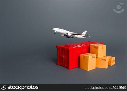 Cargo plane over container and boxes. Services of express delivery and transportation of goods by plane. World trade and logistics. Business and commerce, import export of products.