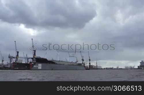 Cargo ship in Hamburg port. Timelapse.