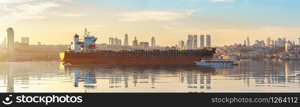 Cargo ship in Istanbul at sunset. Bosphorus strait.. Ship and Bosphorus Strait
