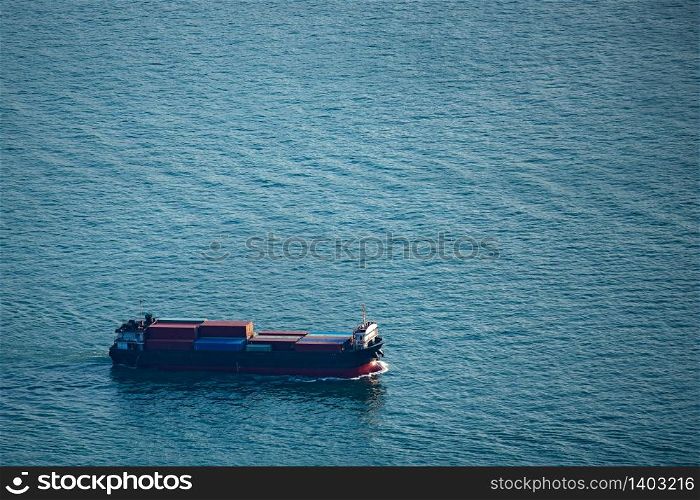 Cargo ship in the bay of Hong Kong, International shipping concept