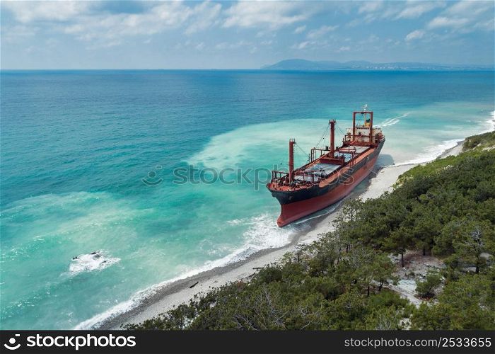 Cargo ship stranded after a storm, aerial view