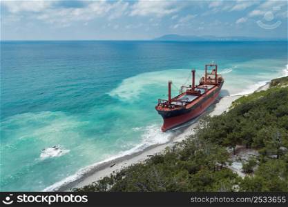 Cargo ship stranded after a storm, aerial view