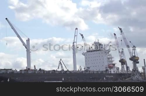 Cargo ship time lapse with fast moving clouds.