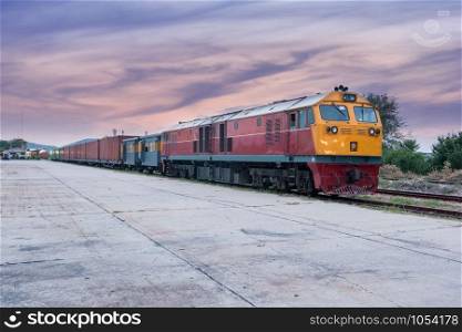 Cargo train and container at twilight of Thailand