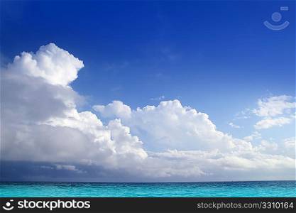Caribbean aqua sea clouds in blue sky cloudscape horizon