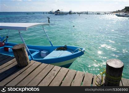 Caribbean beach boat in wood pier of Riviera Maya in Mexico