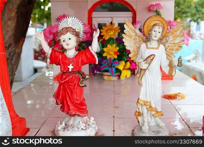 Caribbean cemetery catholic angel saints figures colorful Mexico
