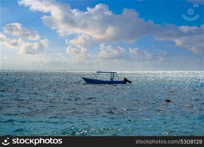 Caribbean sea beach with boat in Mayan riviera of Mexico