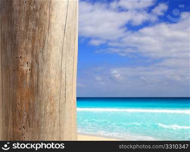Caribbean tropical beach wood weathered pole on sea foreground