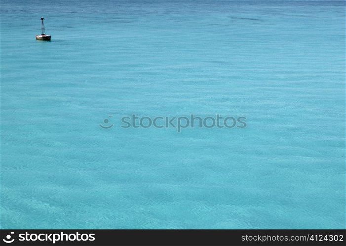 Caribbean turquoise sea with floating buoy far away