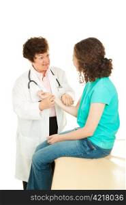 Caring female doctor checking the pulse of her teenage patient. Isolated on white.