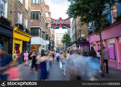 Carnaby Street In London UK With Motion Blurred Shoppers