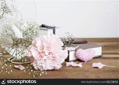 Carnation flowers on wooden table