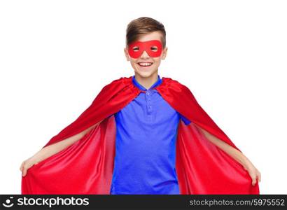 carnival, childhood, power, gesture and people concept - happy boy in red super hero cape and mask